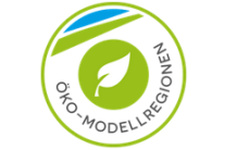 Rundes Logo mit Blatt und Schriftzug Öko-Modellregionen
